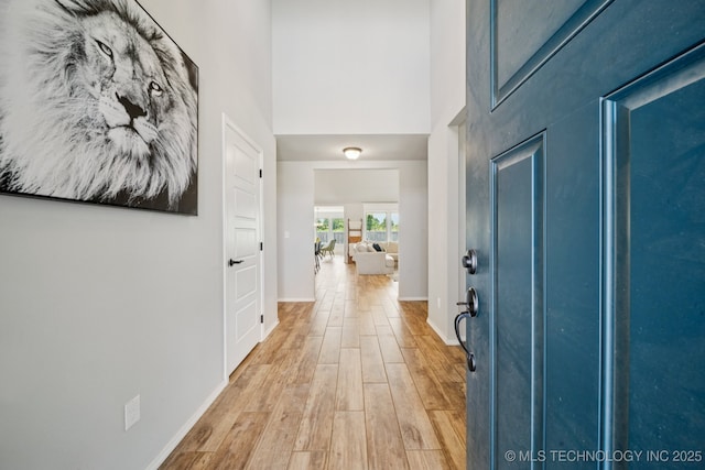 7413 N 160th E Ave, Owasso, OK 74055 - entrance foyer with light wood-style flooring and a towering ceiling