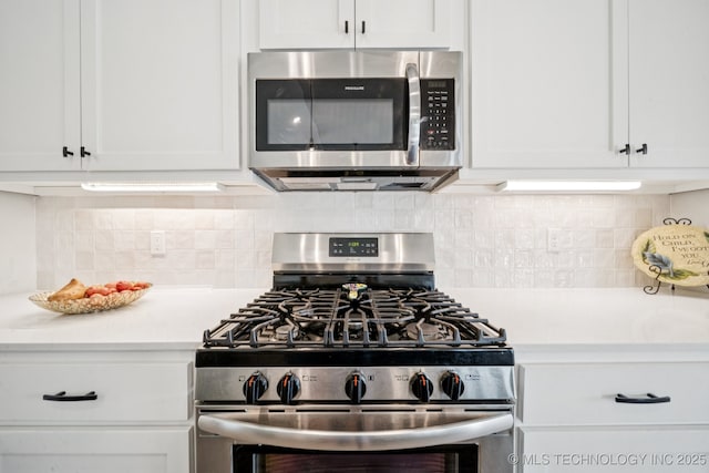7413 N 160th E Ave, Owasso, OK 74055 - kitchen featuring stainless steel appliances, light countertops, white cabinetry, and tasteful backsplash
