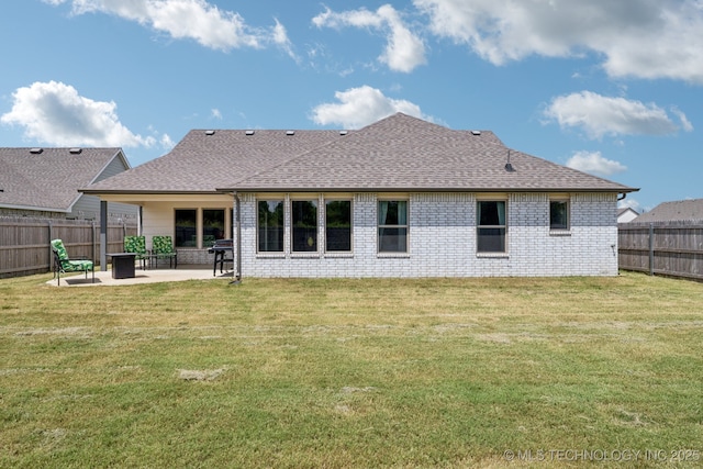 7413 N 160th E Ave, Owasso, OK 74055 - back of house with a patio area, a shingled roof, a fenced backyard, and brick siding