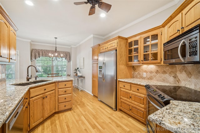 7534 S Hudson Pl, Tulsa, OK 74136 - kitchen featuring appliances with stainless steel finishes, light wood finished floors, a chandelier, tasteful backsplash, and a ceiling fan