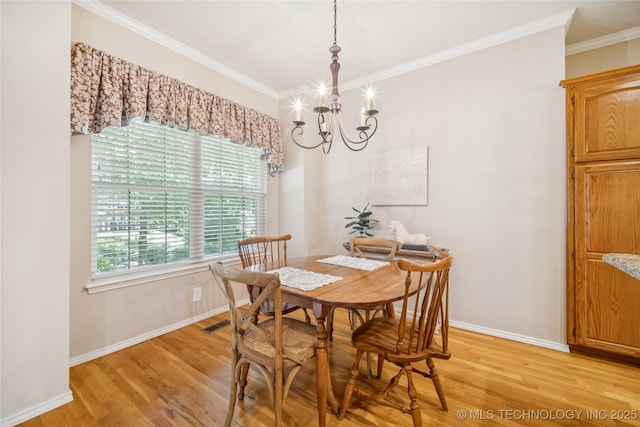 7534 S Hudson Pl, Tulsa, OK 74136 - dining area featuring a chandelier, light wood-style flooring, and crown molding