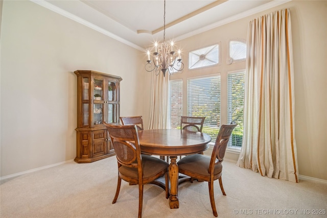 7534 S Hudson Pl, Tulsa, OK 74136 - dining space featuring a chandelier, light colored carpet, crown molding, a raised ceiling, and a towering ceiling