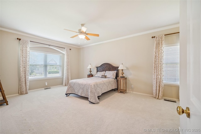 7534 S Hudson Pl, Tulsa, OK 74136 - carpeted bedroom with ornamental molding and a ceiling fan