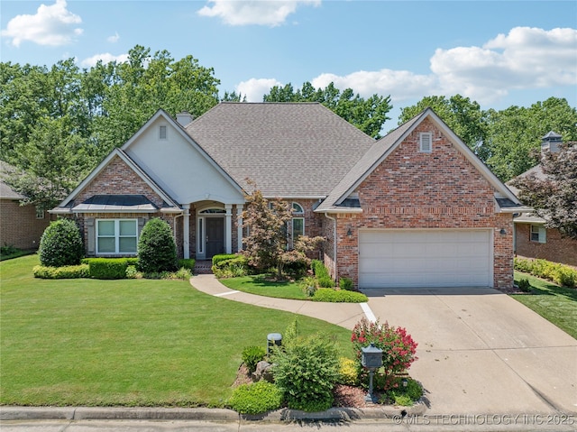 7534 S Hudson Pl, Tulsa, OK 74136 - traditional home featuring brick siding, a front lawn, concrete driveway, an attached garage, and a chimney