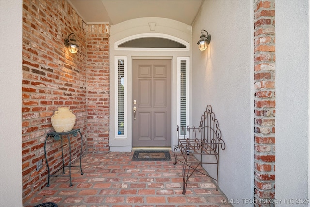 7534 S Hudson Pl, Tulsa, OK 74136 - property entrance with brick siding and stucco siding