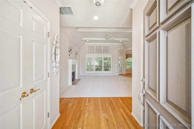7534 S Hudson Pl, Tulsa, OK 74136 - foyer entrance with ceiling fan, light wood-style flooring, a fireplace with flush hearth, and recessed lighting