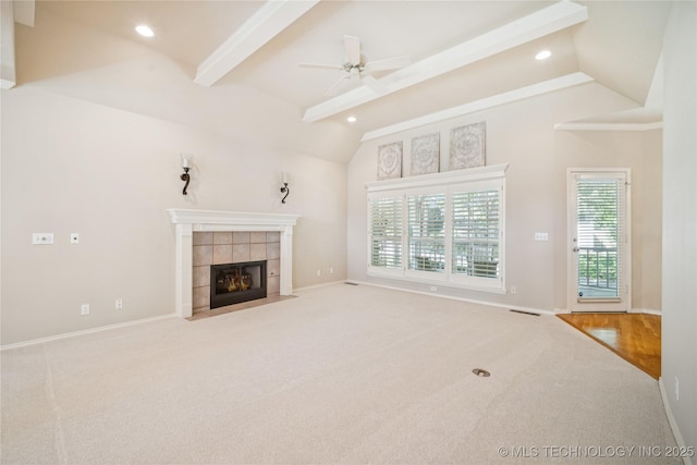 7534 S Hudson Pl, Tulsa, OK 74136 - unfurnished living room featuring carpet flooring, a tiled fireplace, ceiling fan, and recessed lighting
