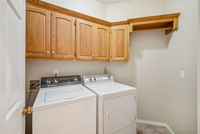 7534 S Hudson Pl, Tulsa, OK 74136 - washroom featuring washer and clothes dryer, cabinet space, and tile patterned floors