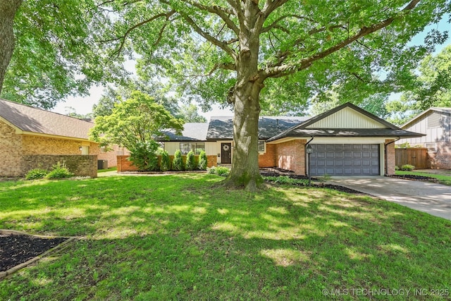 3350 E 54th St, Tulsa, OK 74135 - view of front of house featuring driveway, brick siding, and an attached garage