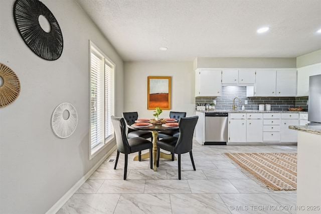 3350 E 54th St, Tulsa, OK 74135 - dining area featuring light marble finish floors, recessed lighting, and a textured ceiling