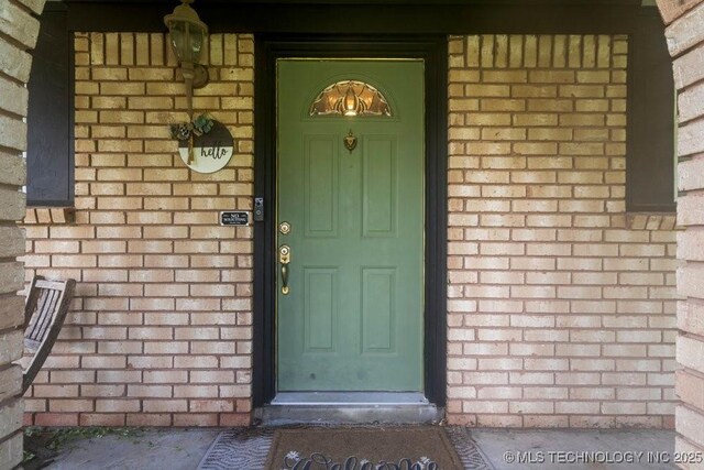 22 Mary St, Kiefer, OK 74041 - view of exterior entry with brick siding