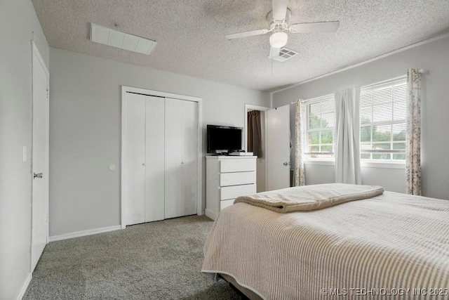 22 Mary St, Kiefer, OK 74041 - carpeted bedroom featuring a closet, a textured ceiling, and a ceiling fan