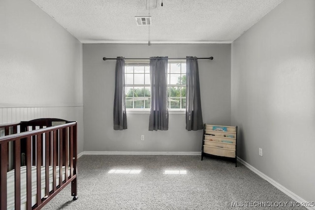 22 Mary St, Kiefer, OK 74041 - bedroom with a textured ceiling, carpet floors, and a nursery area