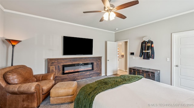 21820 Summit Trl, Claremore, OK 74019 - bedroom with ornamental molding, a glass covered fireplace, and ceiling fan
