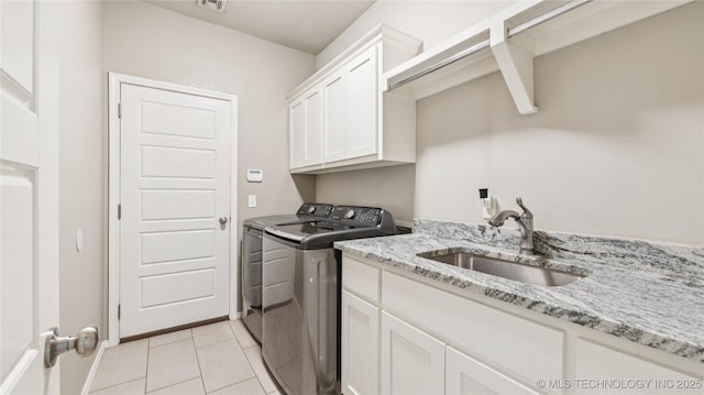 21820 Summit Trl, Claremore, OK 74019 - laundry area with washer and dryer, cabinet space, and light tile patterned floors