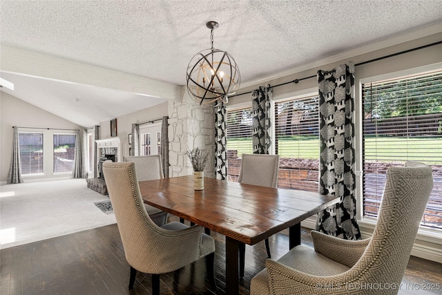 9622 S Maplewood Ave, Tulsa, OK 74137 - dining room with a chandelier, a textured ceiling, hardwood / wood-style floors, lofted ceiling, and a fireplace