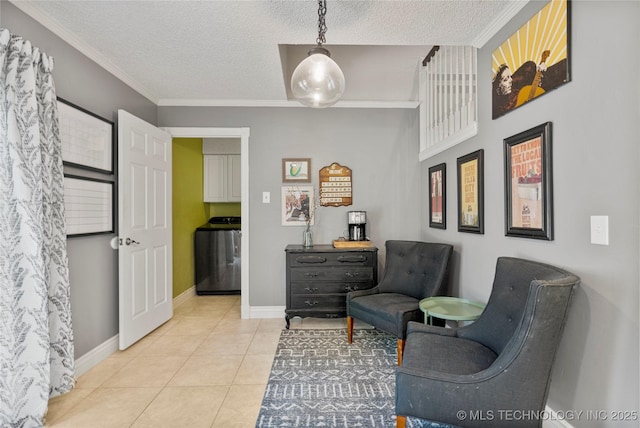 9622 S Maplewood Ave, Tulsa, OK 74137 - sitting room featuring washer / clothes dryer, ornamental molding, light tile patterned floors, and a textured ceiling