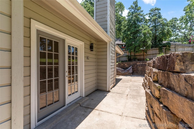 9622 S Maplewood Ave, Tulsa, OK 74137 - property entrance with a chimney and a patio area