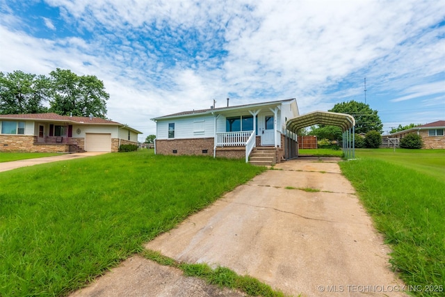 104 Gardenia Pl, Mannford, OK 74044 - view of front of house with concrete driveway, a carport, a front lawn, and covered porch