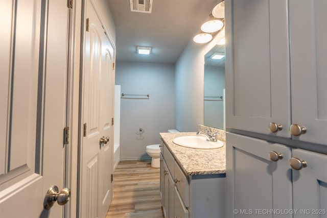 104 Gardenia Pl, Mannford, OK 74044 - full bathroom featuring vanity, a bathtub, and wood finished floors