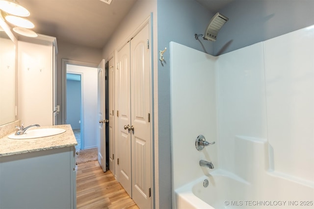 104 Gardenia Pl, Mannford, OK 74044 - full bath featuring vanity, shower / bathtub combination, wood finished floors, and a closet
