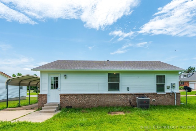 104 Gardenia Pl, Mannford, OK 74044 - rear view of property featuring brick siding, a carport, a lawn, and roof with shingles