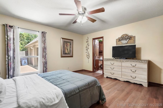 4335 E 87th St, Tulsa, OK 74137 - bedroom with wood finished floors, ceiling fan, and ensuite bathroom