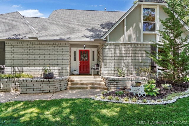 4335 E 87th St, Tulsa, OK 74137 - view of exterior entry featuring brick siding, a lawn, and roof with shingles