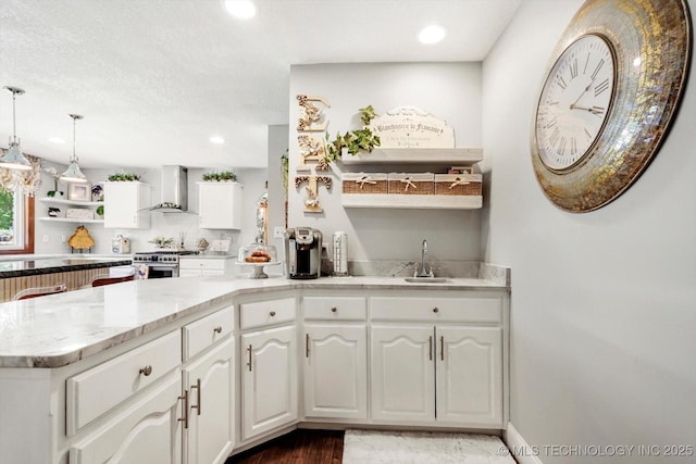 4335 E 87th St, Tulsa, OK 74137 - kitchen with open shelves, wall chimney exhaust hood, high end stainless steel range, white cabinets, and recessed lighting