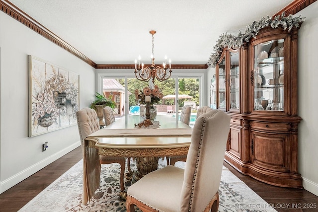 4335 E 87th St, Tulsa, OK 74137 - dining area featuring a chandelier, dark wood-style flooring, and crown molding