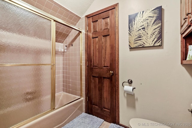 4335 E 87th St, Tulsa, OK 74137 - full bath featuring bath / shower combo with glass door, tile patterned flooring, and vaulted ceiling
