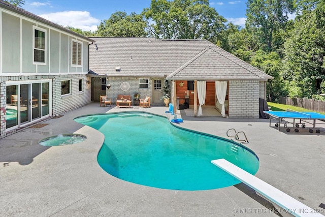4335 E 87th St, Tulsa, OK 74137 - view of pool featuring a patio, an in-ground hot tub, an outdoor living space, and a diving board