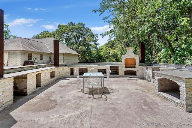 4335 E 87th St, Tulsa, OK 74137 - view of patio featuring an outdoor stone fireplace