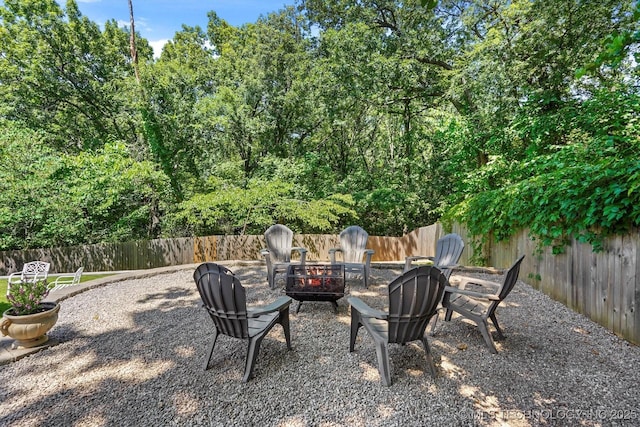 4335 E 87th St, Tulsa, OK 74137 - fenced backyard featuring a fire pit
