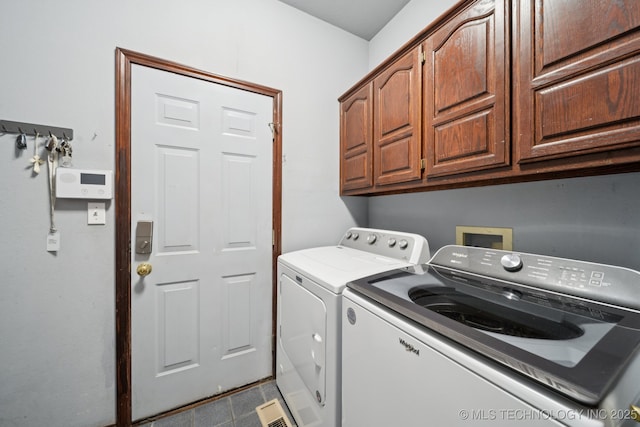 10102 N 147th E Ave, Owasso, OK 74055 - washroom with washing machine and dryer, cabinet space, and tile patterned floors