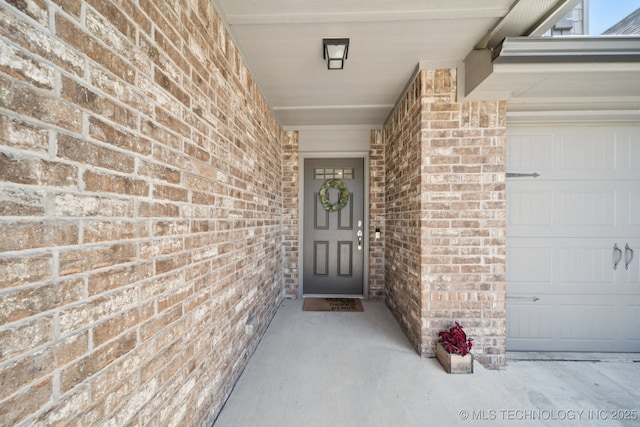 2618 W 115th St S, Jenks, OK 74037 - property entrance featuring brick siding and an attached garage