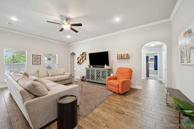 2618 W 115th St S, Jenks, OK 74037 - living area featuring arched walkways, a ceiling fan, ornamental molding, light wood-type flooring, and recessed lighting