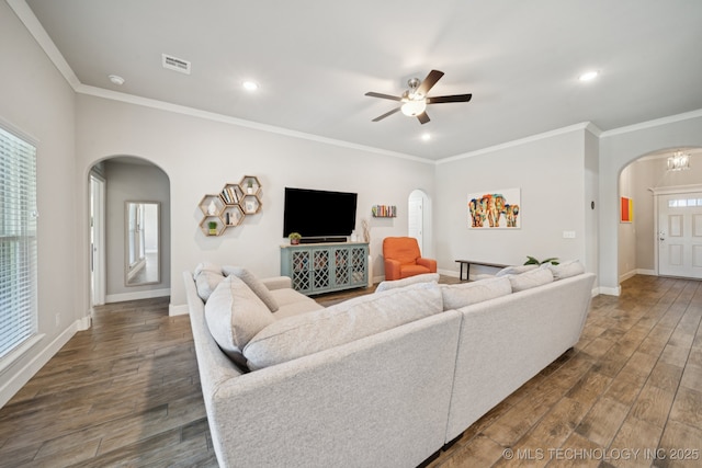 2618 W 115th St S, Jenks, OK 74037 - living area with arched walkways, dark wood finished floors, a ceiling fan, crown molding, and recessed lighting