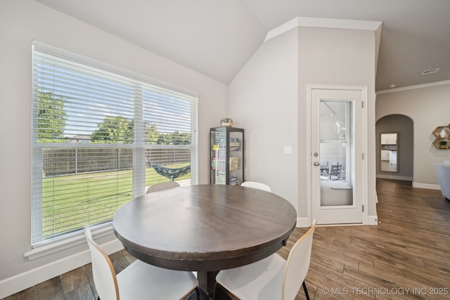 2618 W 115th St S, Jenks, OK 74037 - dining area featuring arched walkways and wood finished floors
