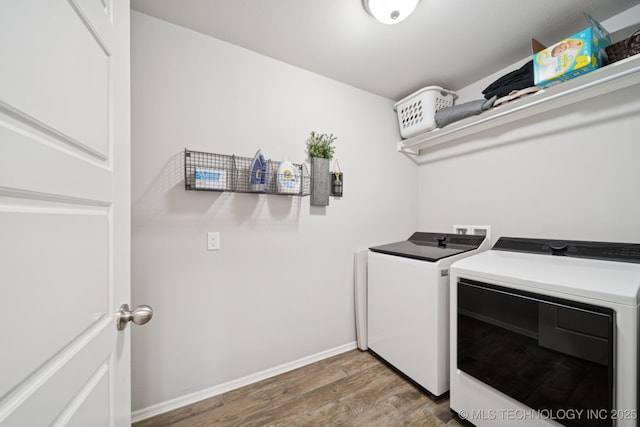 2618 W 115th St S, Jenks, OK 74037 - laundry area with washing machine and dryer and wood finished floors