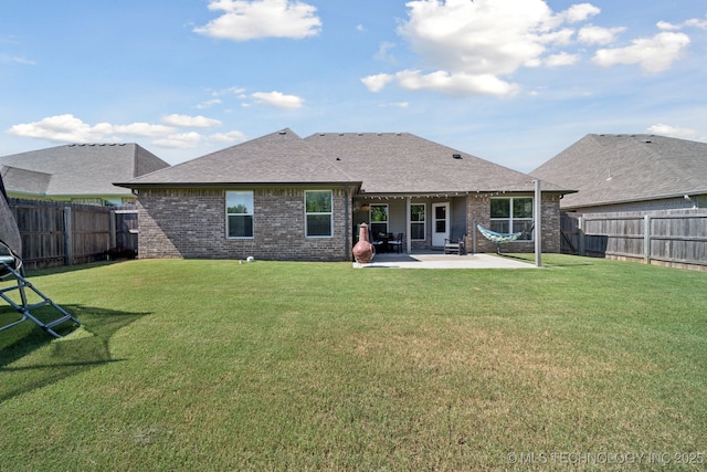 2618 W 115th St S, Jenks, OK 74037 - rear view of property with brick siding, a patio, a fenced backyard, and roof with shingles