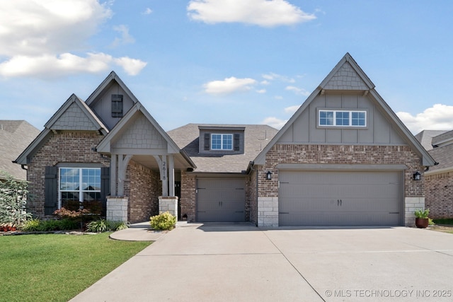 2618 W 115th St S, Jenks, OK 74037 - craftsman-style house with brick siding, driveway, board and batten siding, a front yard, and roof with shingles