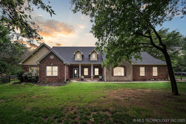 4852 E Redbud Dr, Claremore, OK 74019 - new england style home featuring brick siding, covered porch, and a shingled roof
