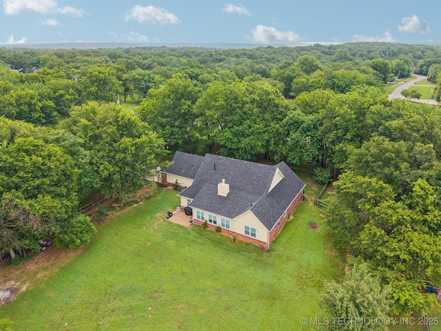 4852 E Redbud Dr, Claremore, OK 74019 - view from above of property with a heavily wooded area