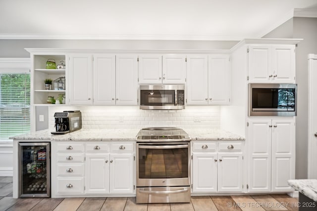 4852 E Redbud Dr, Claremore, OK 74019 - kitchen featuring stainless steel appliances, wine cooler, open shelves, white cabinets, and ornamental molding