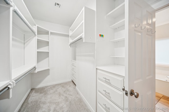 4852 E Redbud Dr, Claremore, OK 74019 - walk in closet with light carpet