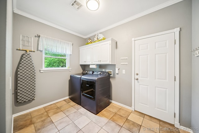 4852 E Redbud Dr, Claremore, OK 74019 - laundry area featuring washing machine and dryer, crown molding, cabinet space, and light tile patterned floors