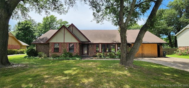 9712 S Hudson Ave, Tulsa, OK 74137 - tudor-style house with a front yard