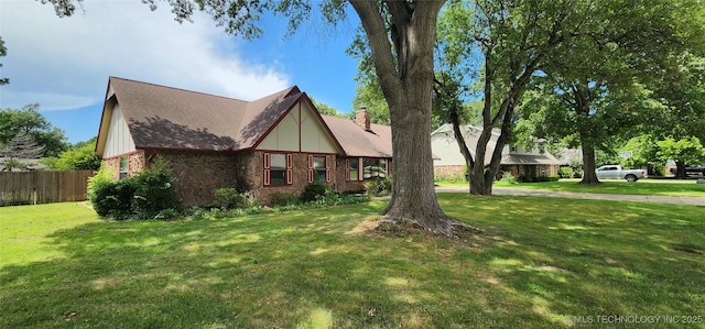 9712 S Hudson Ave, Tulsa, OK 74137 - view of front of property featuring a chimney, stone siding, and a shingled roof
