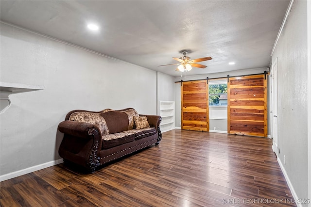 6264 E Latimer St, Tulsa, OK 74115 - sitting room with a ceiling fan, a barn door, wood finished floors, and recessed lighting